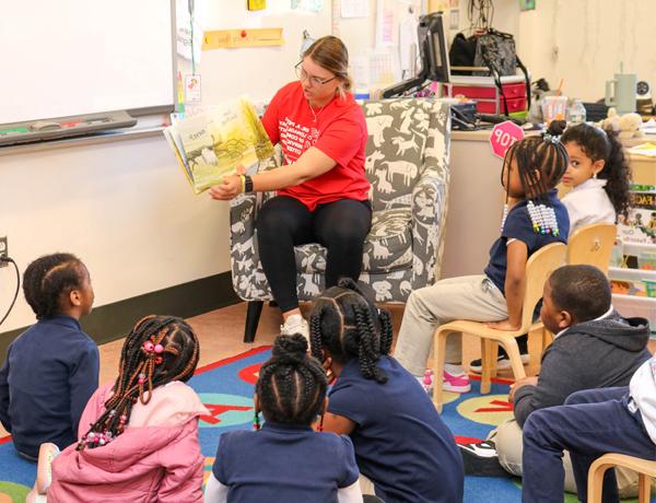 student reading book in classroom