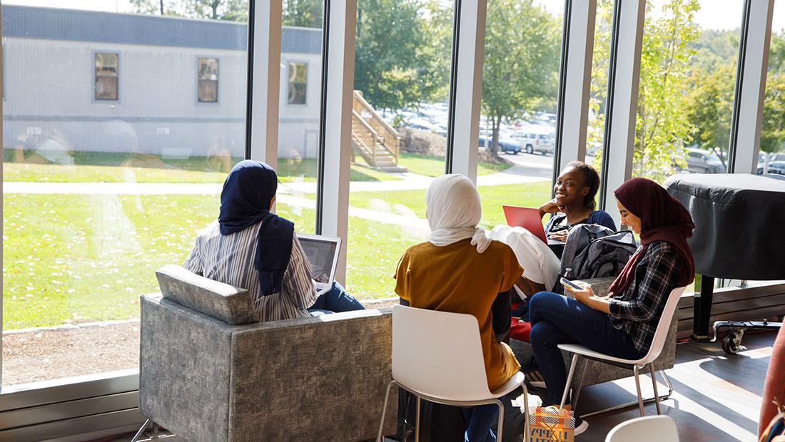 UHart students sitting together in GSU Hawk Lounge